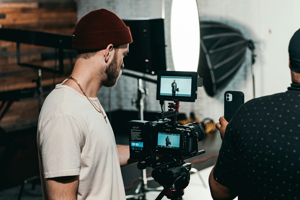 A creator filming with a camera rig in a studio